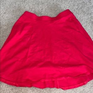 Short, flowy, red skirt